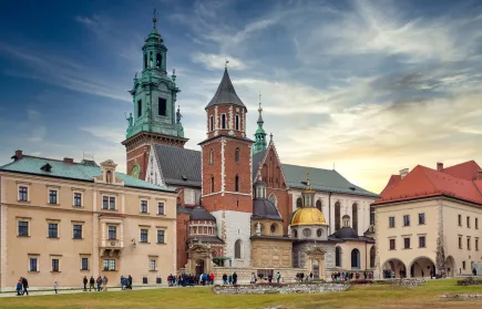 old roman catholic cathedral and aged buildings at sundown